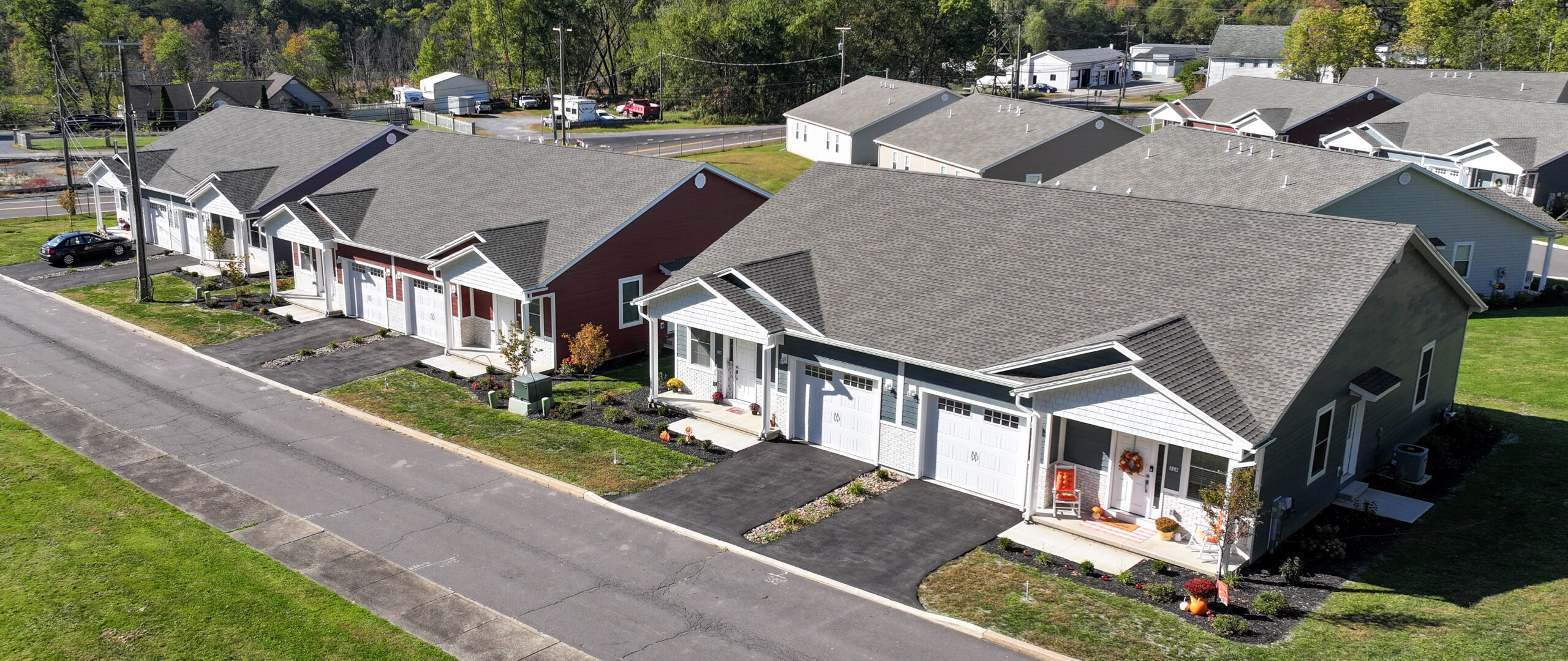 A newly built two family residential home with modern exterior design, showcasing lifestyle homes for buyers looking to build a new house or getting a house built.